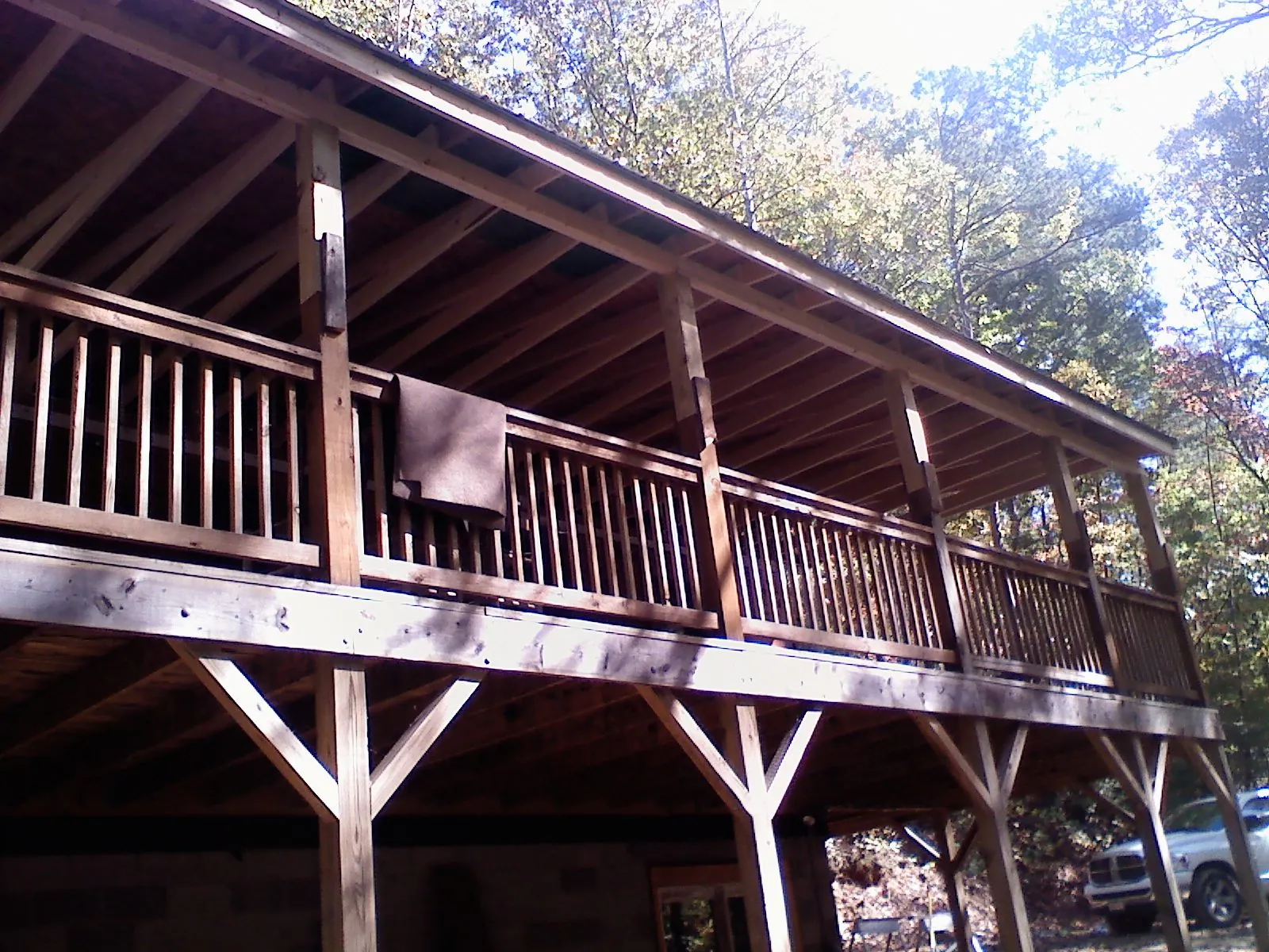 Timber framing under a new elevated porch and deck — Roof Leak Repair in Arriba by Roofing Brothers